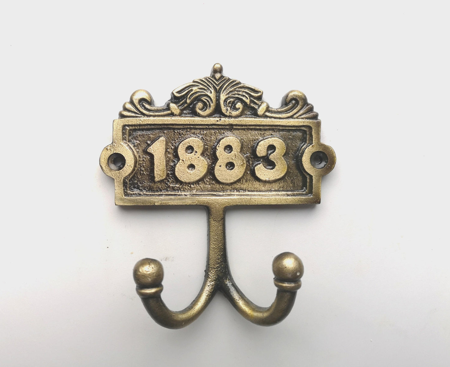 1883 Antique Double coat hook with a pair of matching screws - Cast Iron